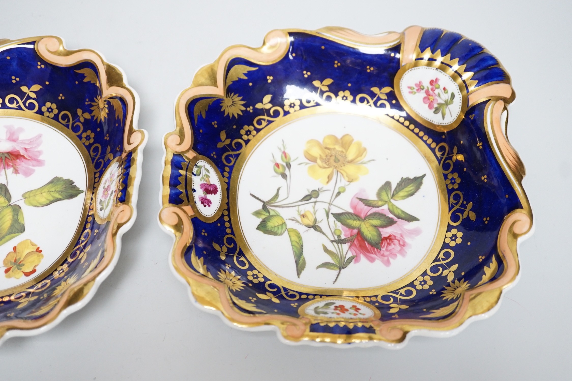 A pair of English porcelain shell shaped dessert dishes, c.1820-25, with floral decoration